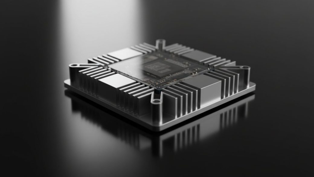 A single advanced AI accelerator chip resting on a clean dark surface, dramatic side lighting catching its metallic edges, shallow depth of field, high contrast, no text