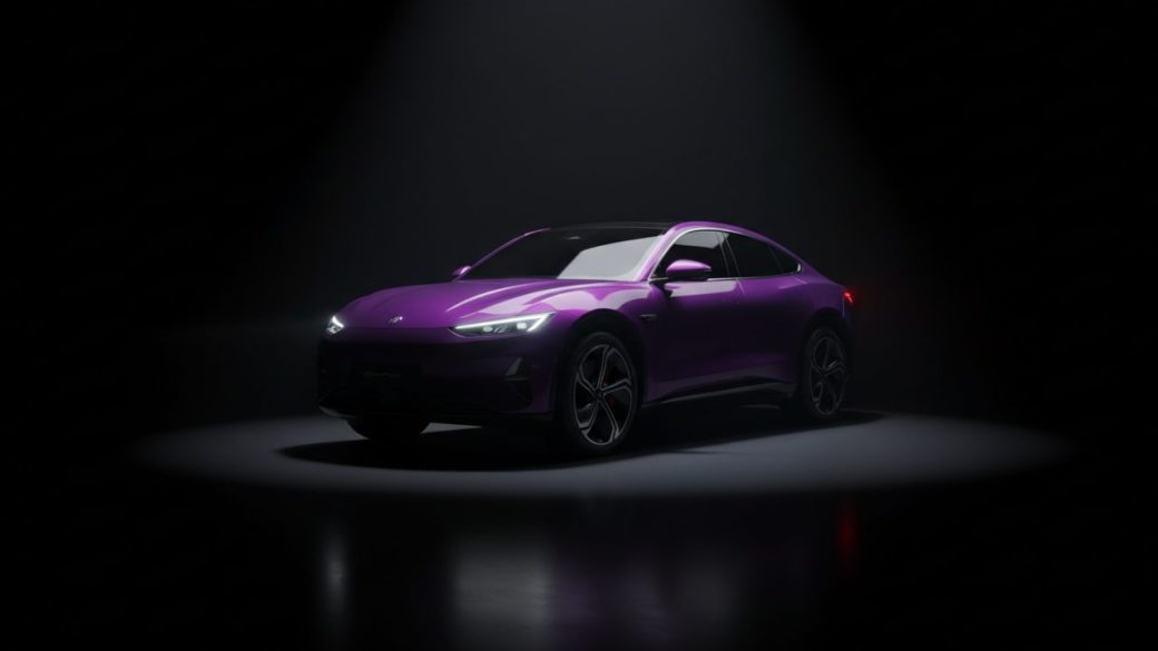 A sleek purple coupe-style electric SUV on a clean studio floor under dramatic spotlighting, single focal subject, high-contrast composition, no text
